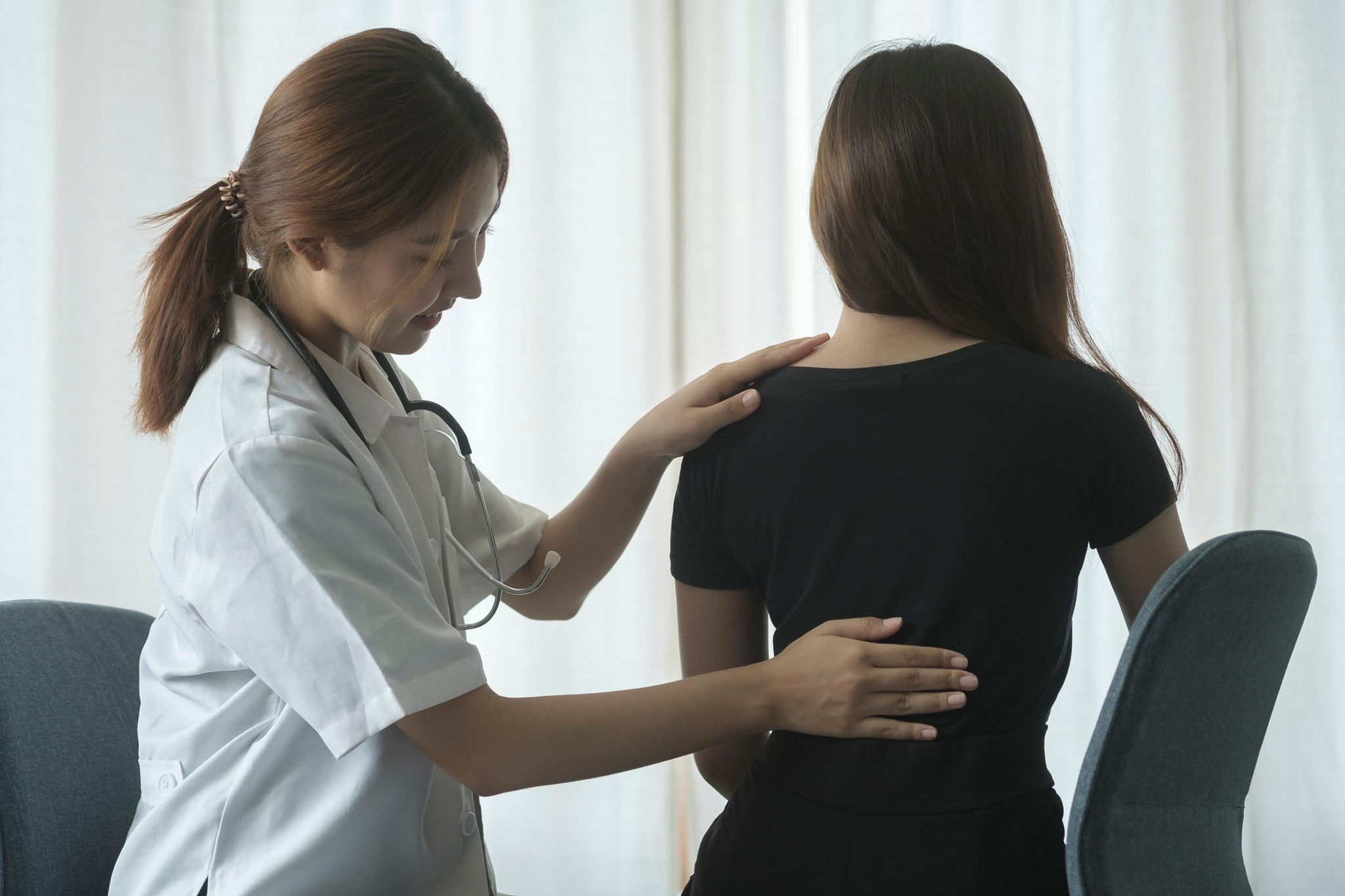 A physiotherapist treating a back injury