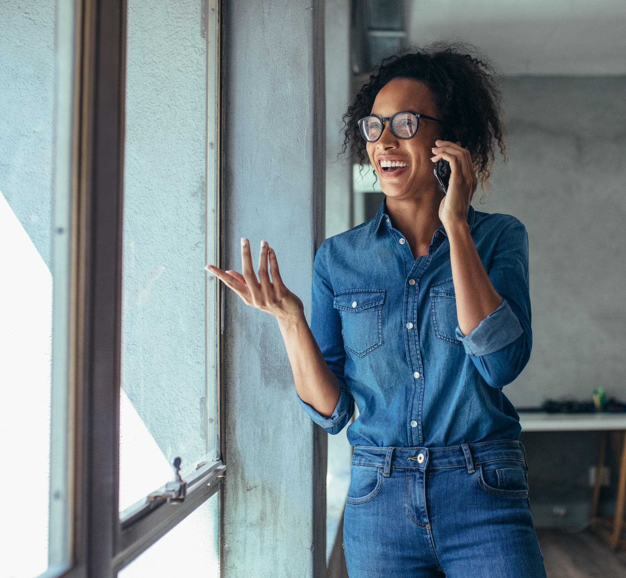 Woman in office talking on the phone
