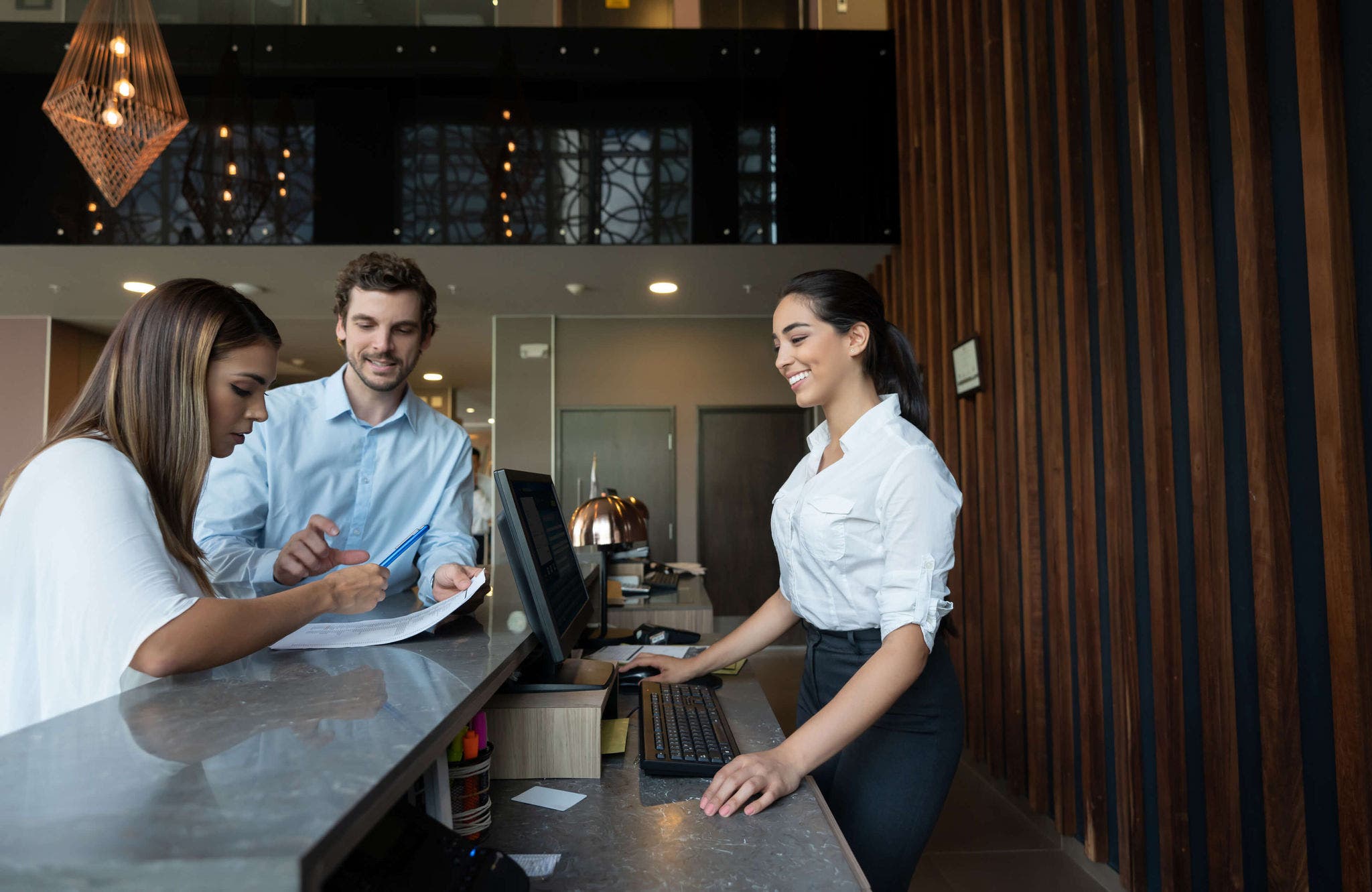 Hotel worker serving customers