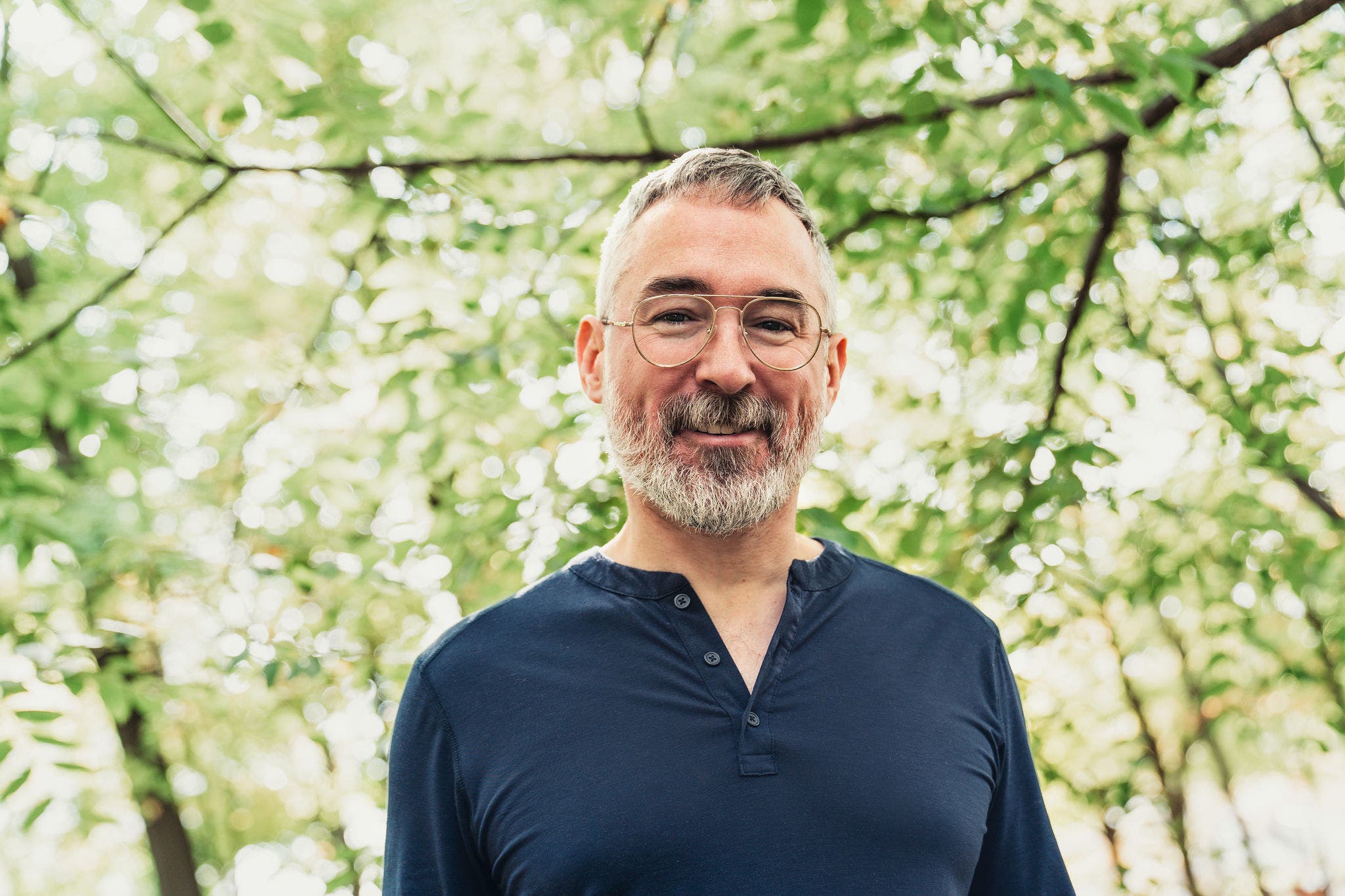 A Portrait of a mature man in an urban park