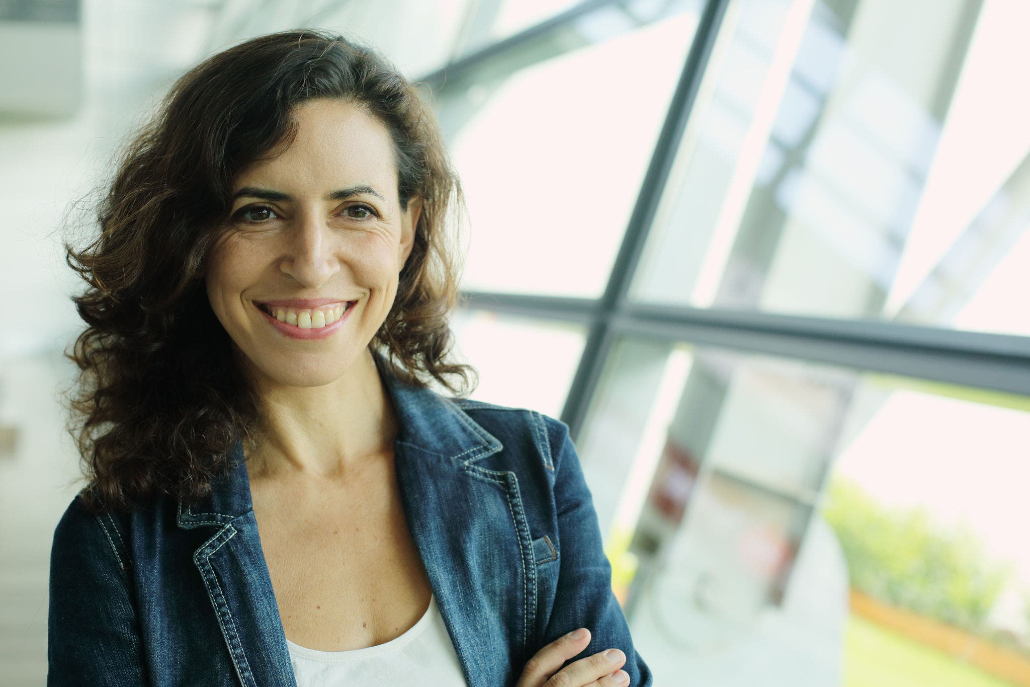 Woman smiling in front of the camera