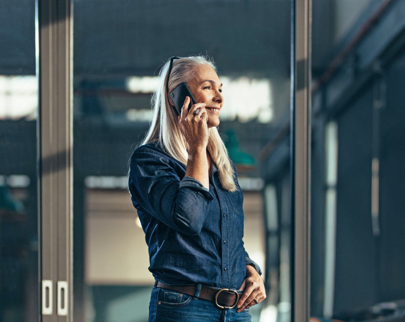 Woman on the phone in a meeting room