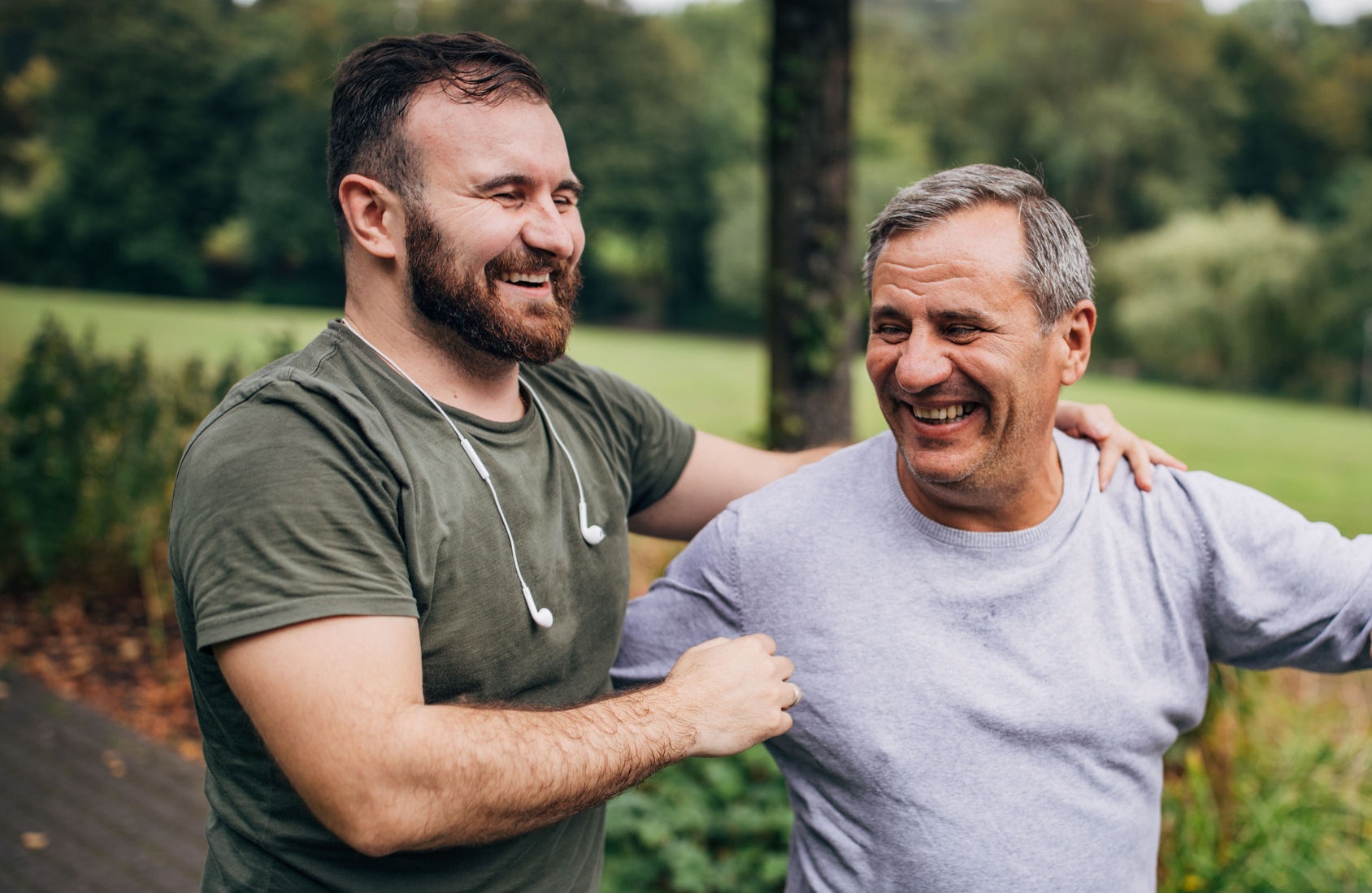 The elder father and the adult son jog