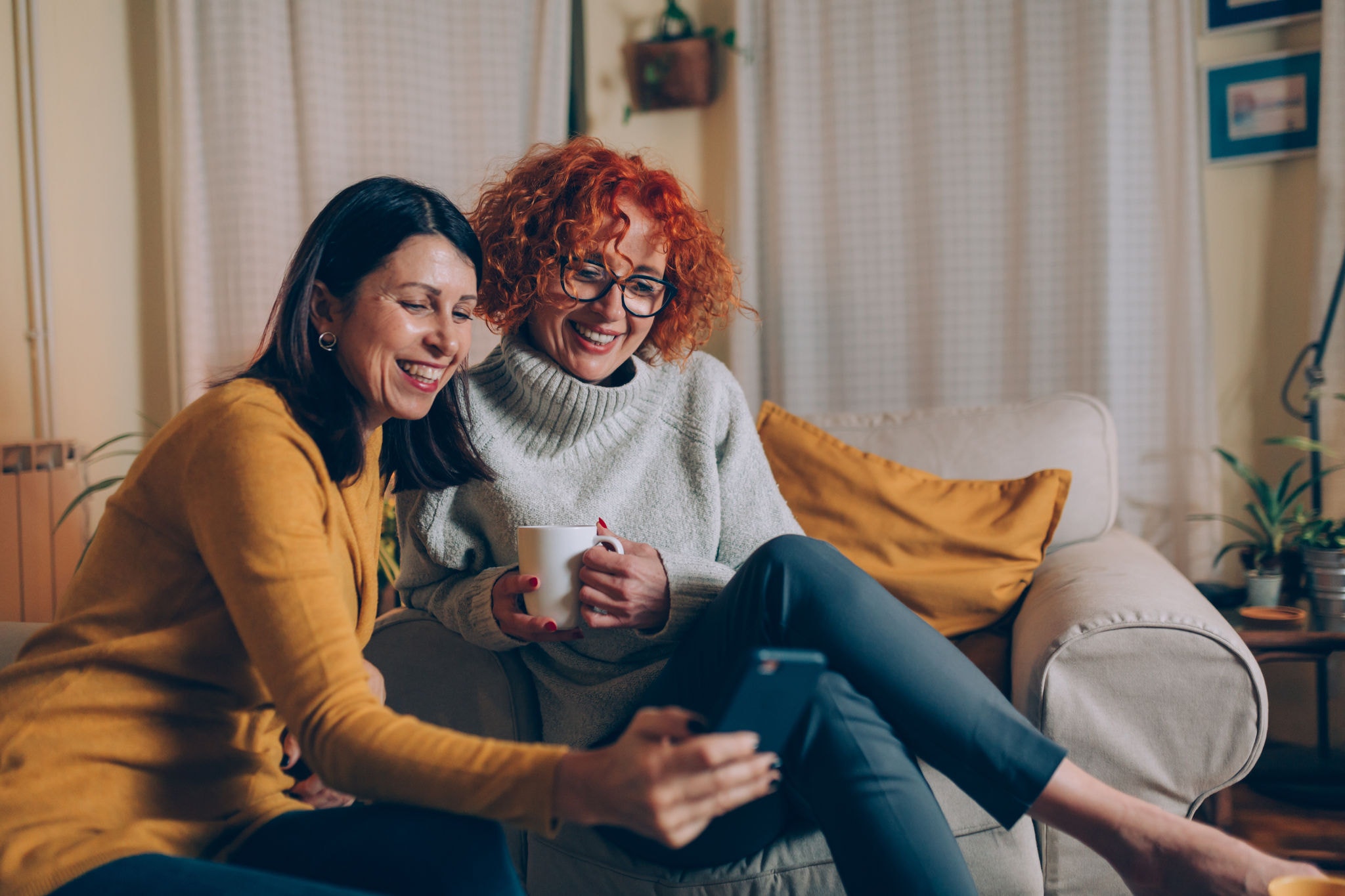 Two friends enjoying a night and having a cup of coffee