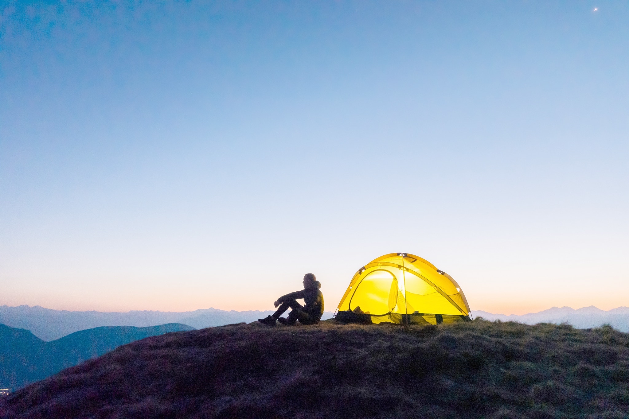 Sun rises over distant Swiss Alps