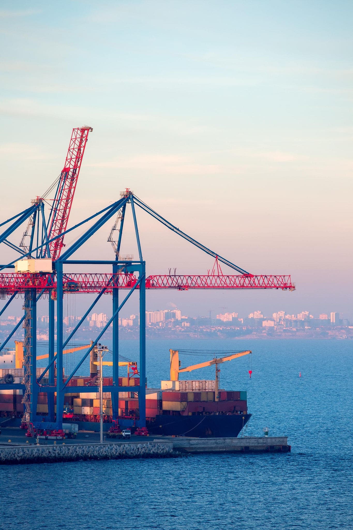 Large cargo ship at a busy seaport