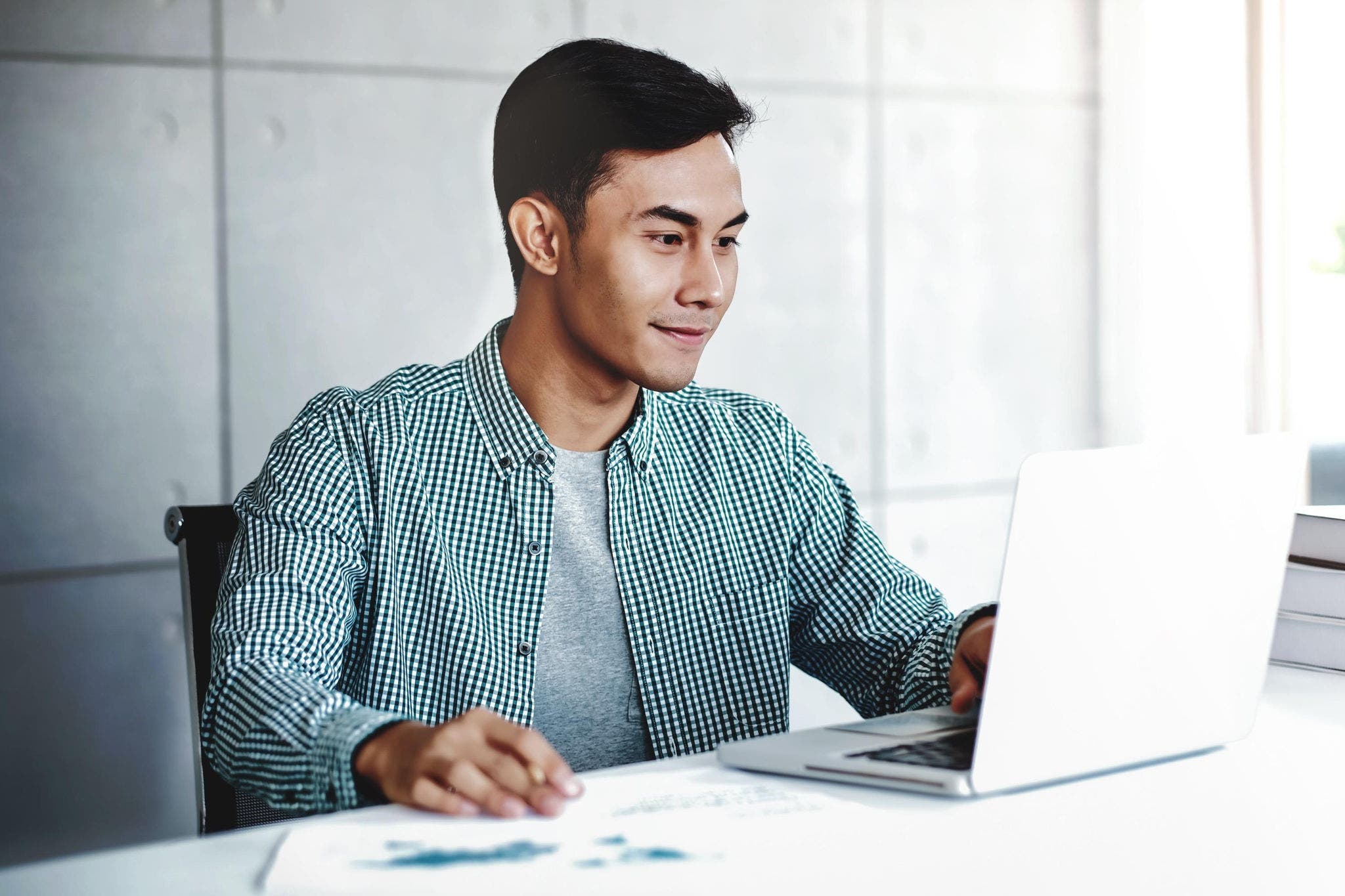 canva-young-male-working-laptop