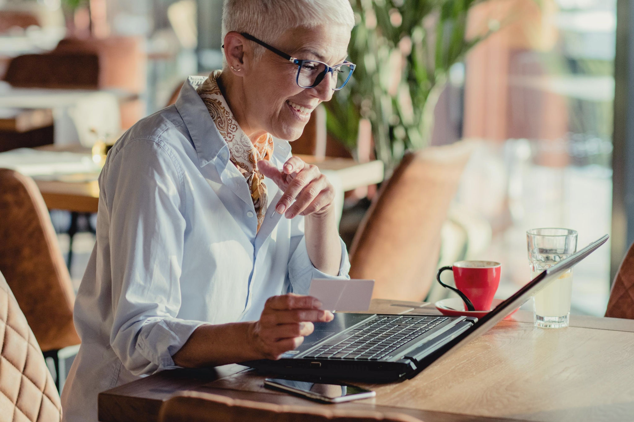 canva-senior-woman-using-laptop