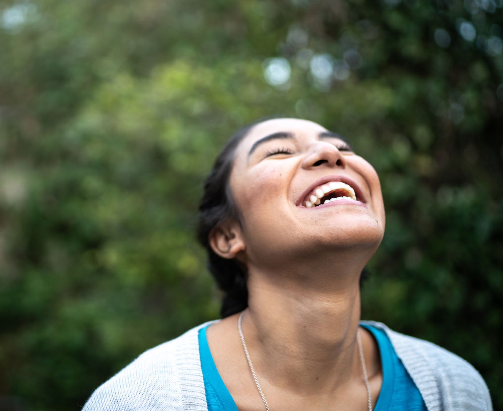 Happy woman inhaling at home