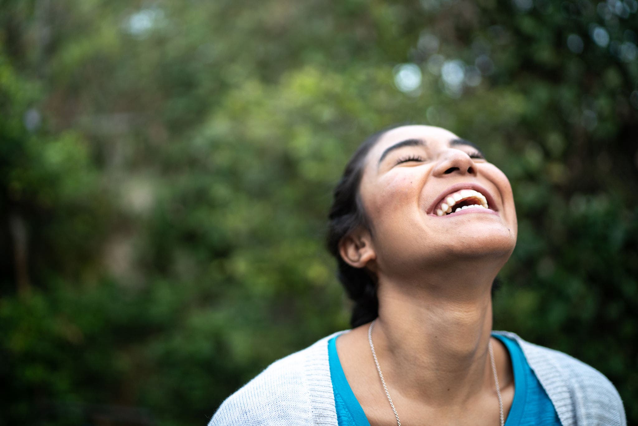 Happy woman inhaling at home