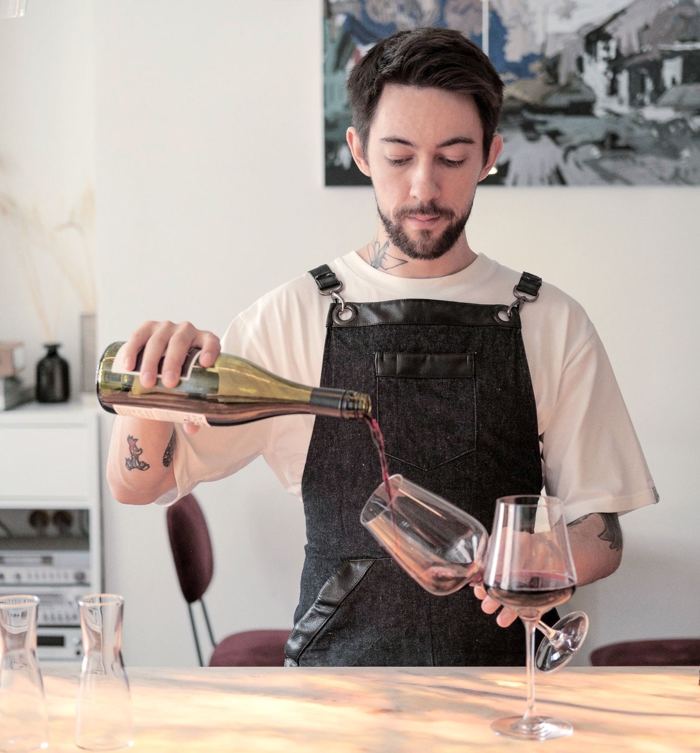 canva-man-pouring-glass-into-red-wine