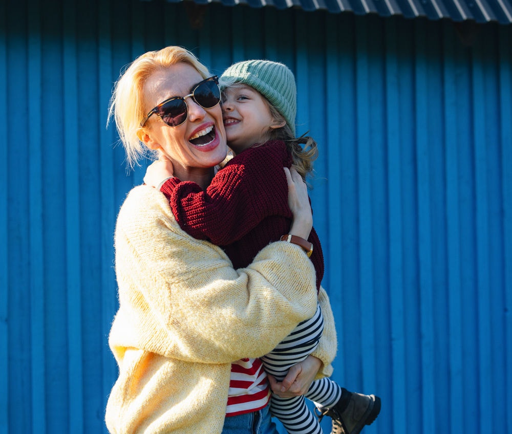 Happy mother holding child