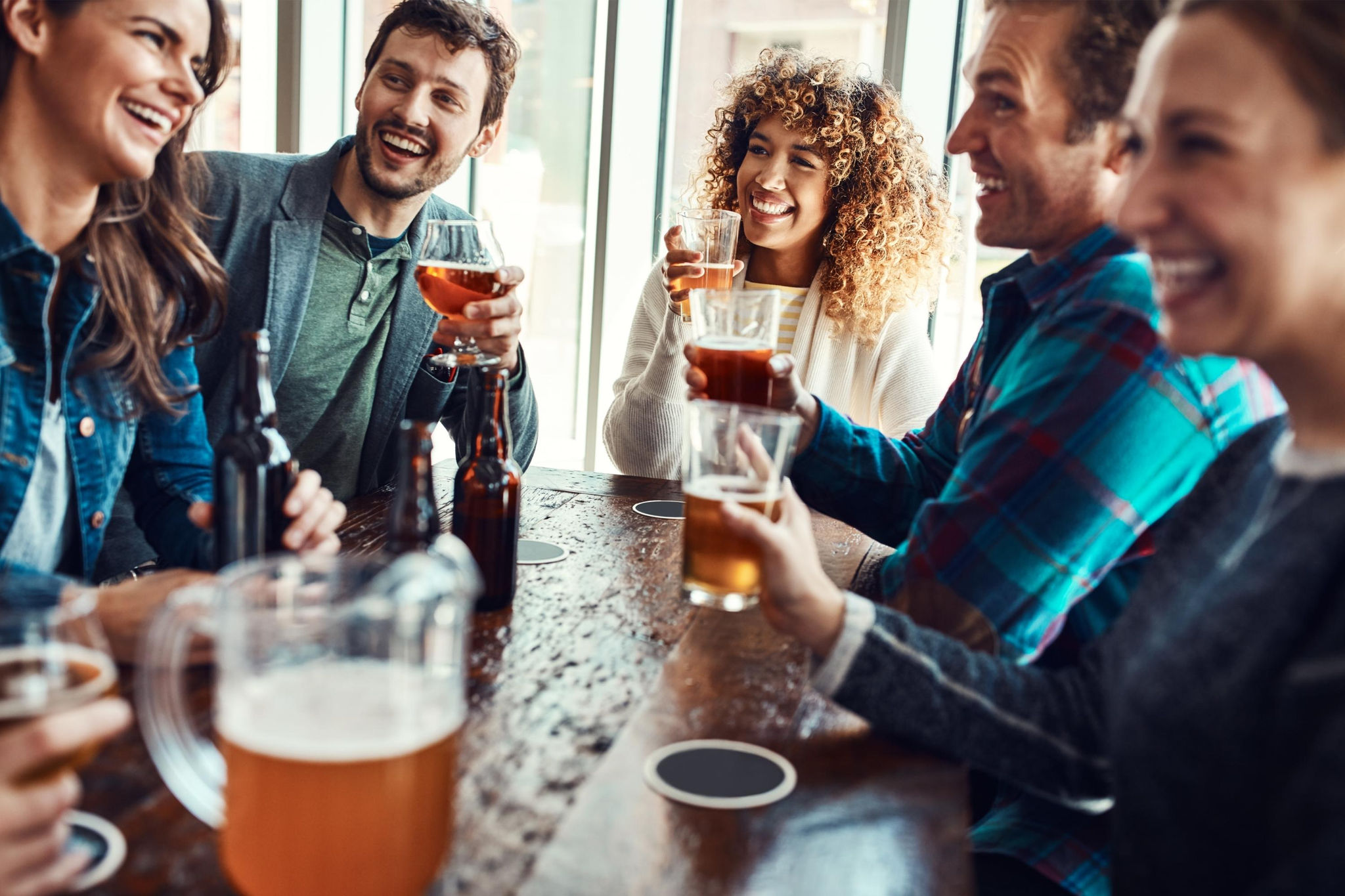 Friends enjoying happy hour at a pub