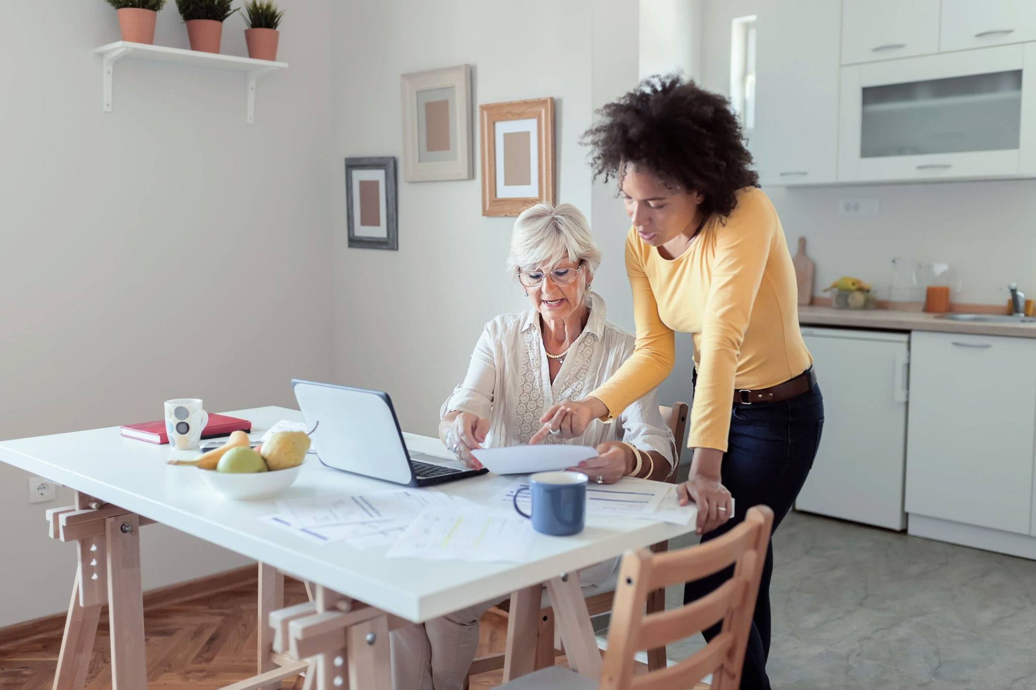 Canva-helping-senior-woman-finances