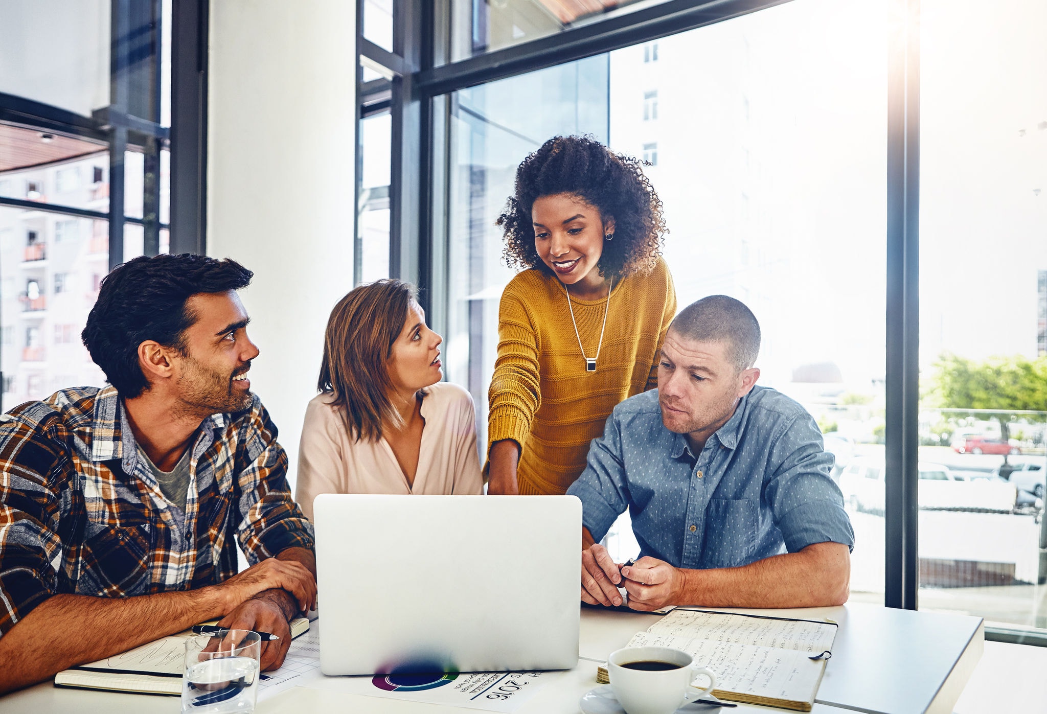 Web designer, planning and team in office with laptop, market research or problem solving in development of project. Website, design and people with technology for online marketing, SEO or strategy.