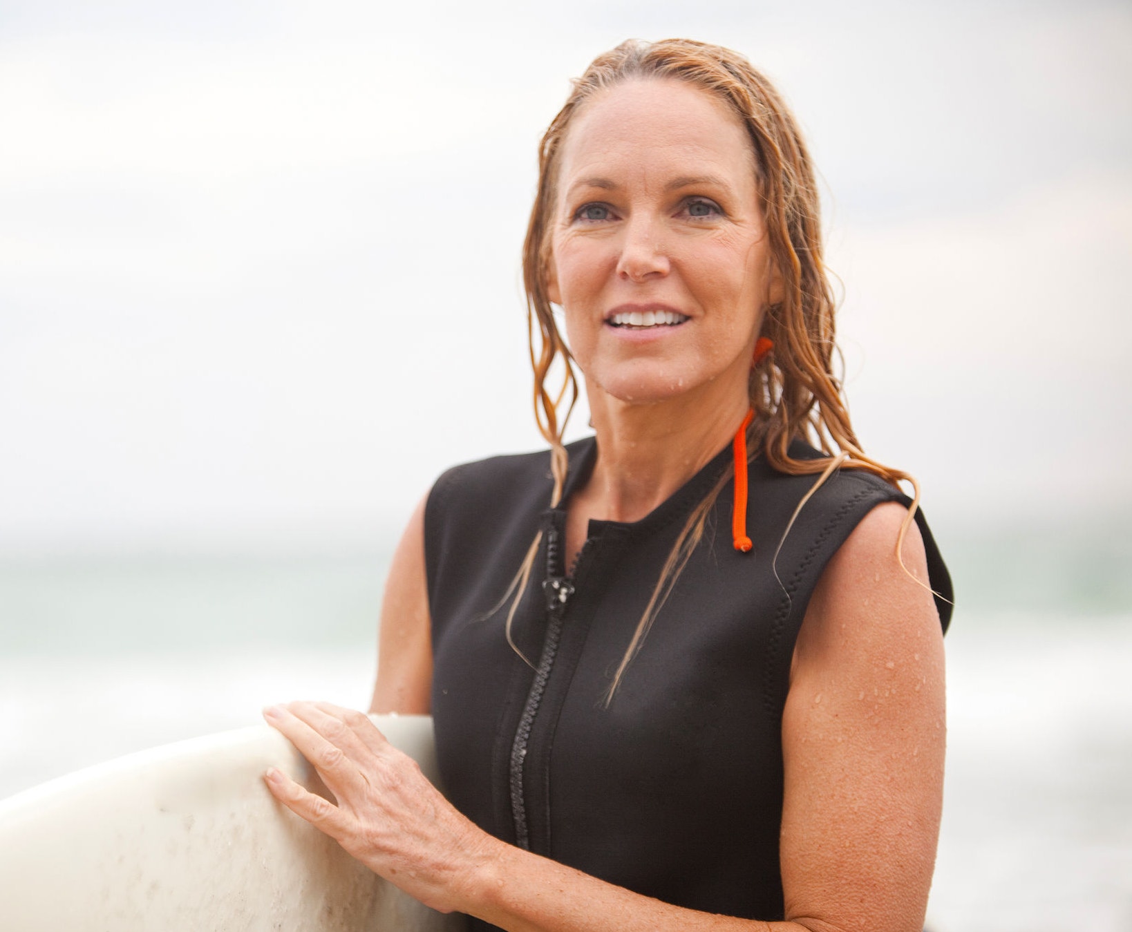 50's women surfer day at the beach