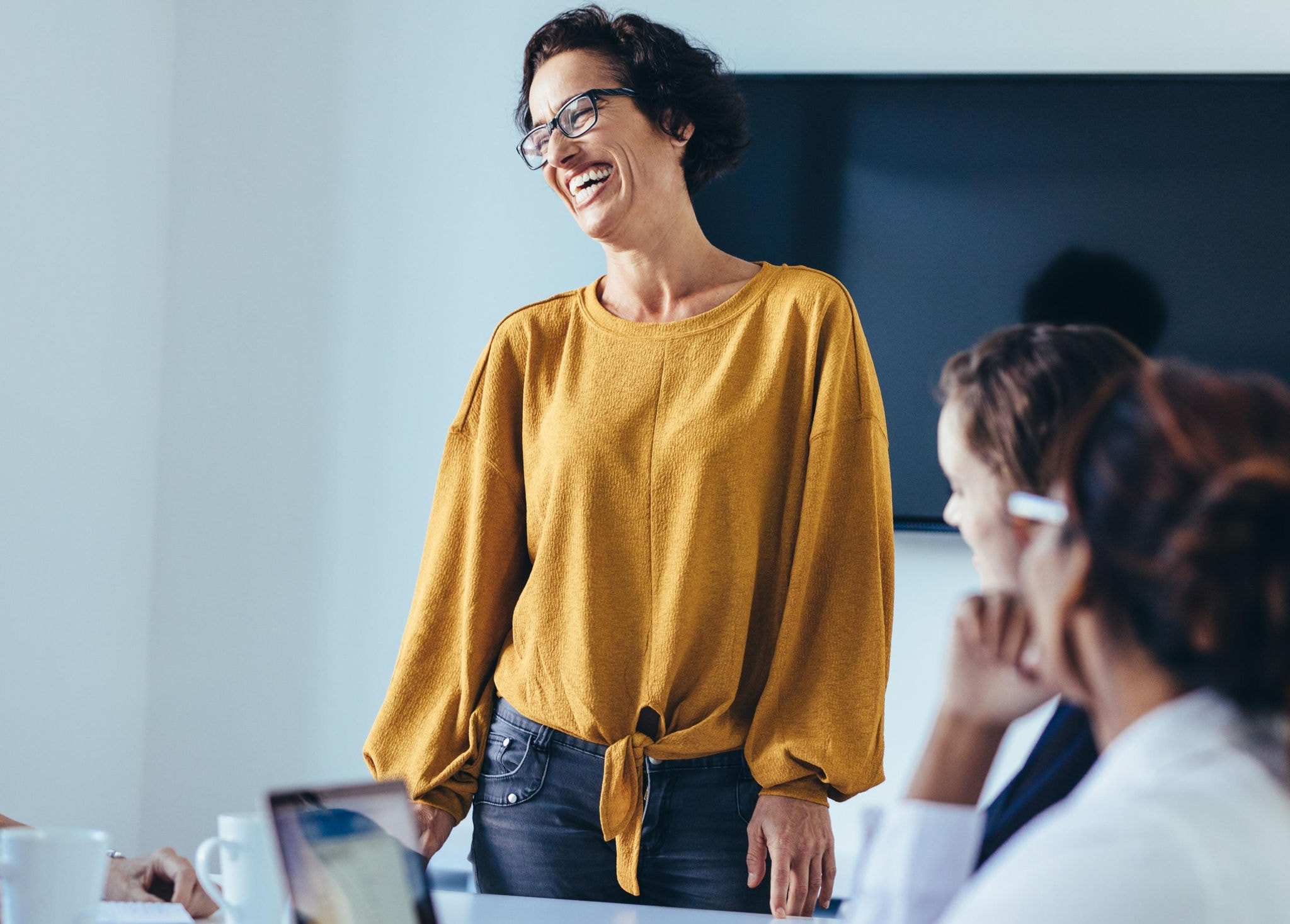 Female team leader leading a meeting with her team