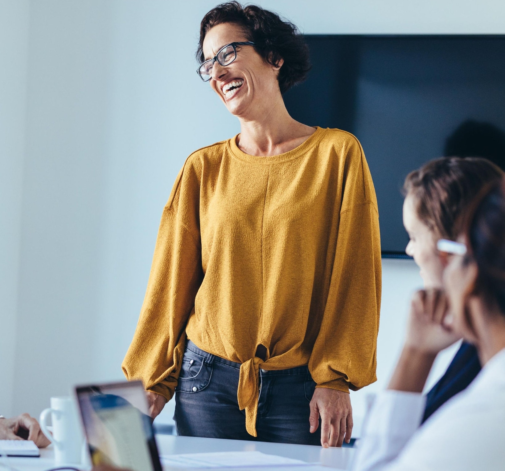 Female team leader leading a meeting with her team