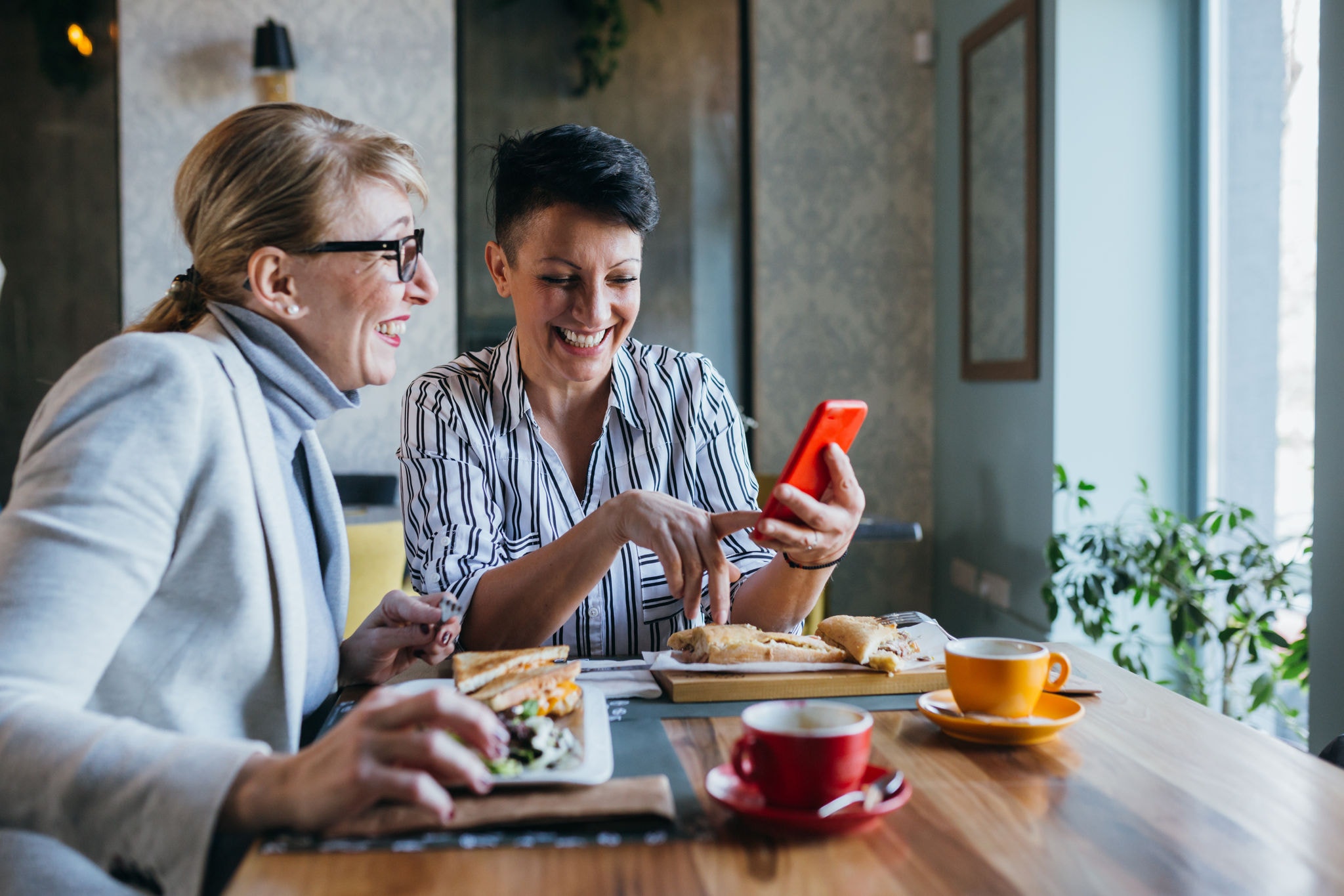 Two female friends enjoying lunch together